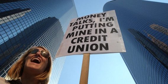 111107_$BOX_CreditUnionProtester_EX.jpg.CROP.rectangle3-large woman picketing downtown with sign