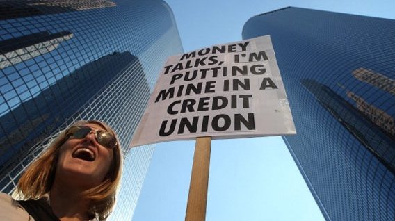 111107_$BOX_CreditUnionProtester_EX.jpg.CROP.rectangle3-large woman picketing downtown with sign
